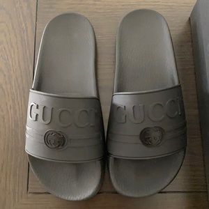 All black Gucci slides